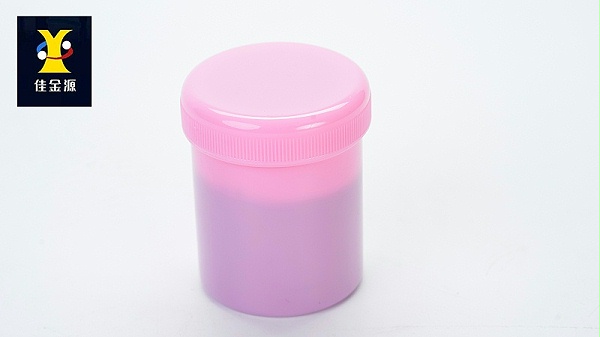 The lead-free solder paste in the red bottle is sealed without a label